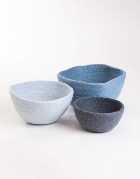Felt Nesting Bowl - Bluethree felt nesting bowls in different sizes and shades of blue on a white background