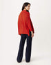 rearview of woman wearing Mersea lisbon red sweater
