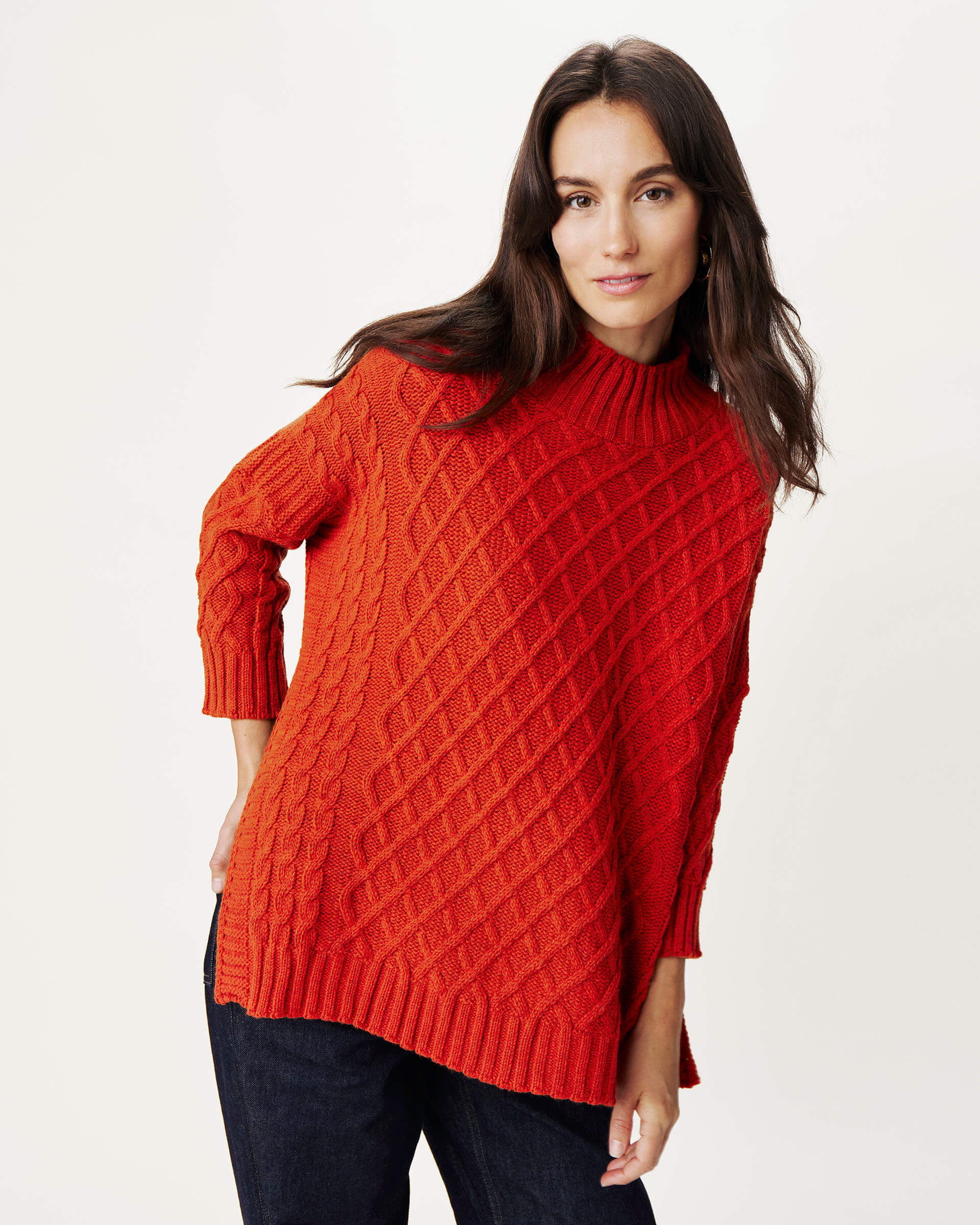 woman wearing Mersea lisbon red sweater against white background