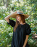 woman wearing Sunshine Wide Brim Hat in nature