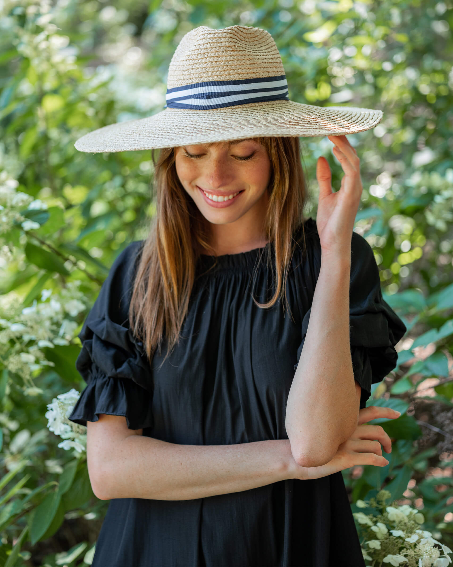 woman wearing Sunshine Wide Brim Hat