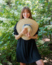 woman holding Sunshine Wide Brim Hat