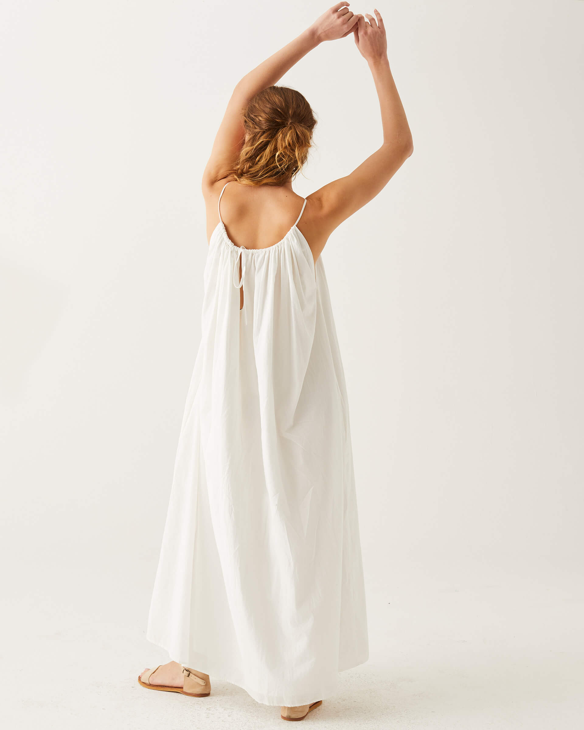 rearview of woman showcasing mersea white patio dress