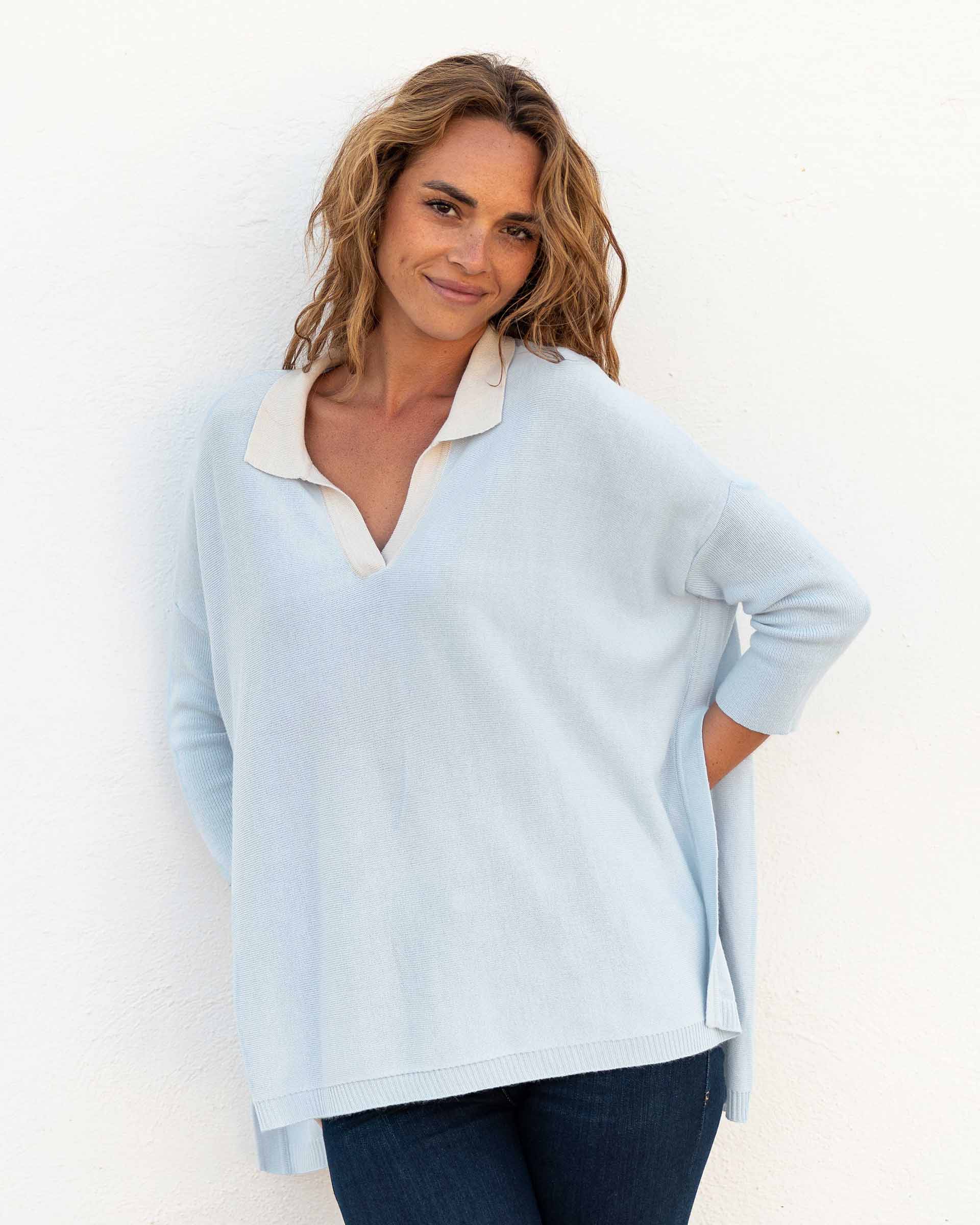 Women's Light Blue Heathered White Collared V-neck Polo Sweater Front View of Hands Behind Back